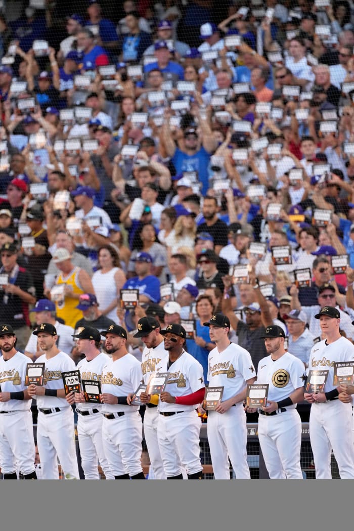 National League players stand up to cancer.